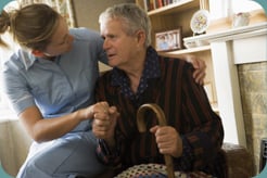 A caregiver comforting an elderly client